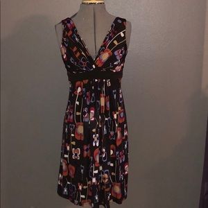 Brown dress with 70s inspired pattern.
